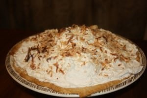 Add whipped cream and coconut