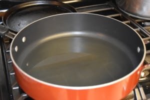 Put oil in pan