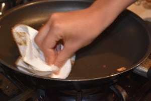 Clean pan with moist papertowel
